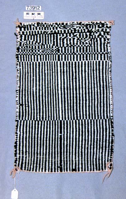 Saddle blanket or rug with self-patterned plain weave