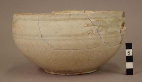 White ware bowl with disc-like base - glaze finish; design of conventional leaves