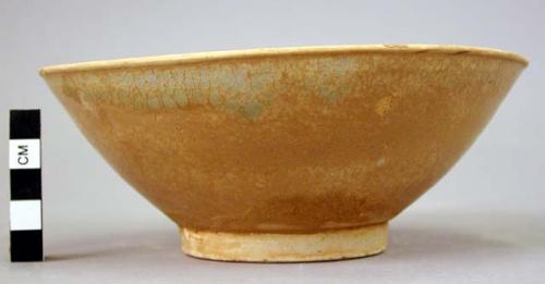 White ware bowl with flaring sides - brownish green glaze; ring-shaped base