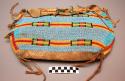 Sioux possible bag. Made from hide. Unevenly shaped flap over opening. Front alm