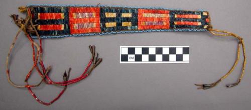 Buckskin ornament & rawhide--decorated w/ porcupine quills, tassels, & cones