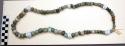 Necklace, ground stone, mostly greenstone, round, 1 w/ side perforation