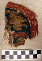 Textile fragment from a rondel.  Silk and wool fibres.  Human figure design.  4