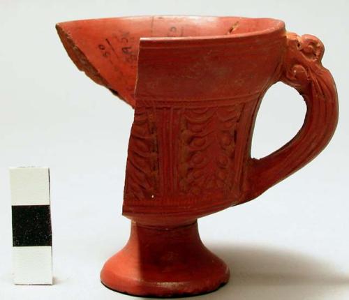 Fragmentary miniature red pottery vase with base and handle