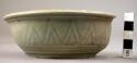 Ceramic bowl sherd, incised leaf design, green glaze on ext., flared rim