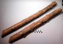 Unclassified tool; carved wood sticks; 1 side grooved; split; remnants of bark