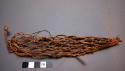Net; knotted veg. fiber; conical shape; twisted veg. fiber cord