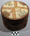 Birchbark box, covered with spruce roots and ornamented