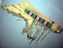 Pair of buckskin chaps, fringed. Decorated w/ weasel fur, beads and applique