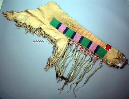 Pair of buckskin chaps, fringed. Decorated w/ weasel fur, beads and applique