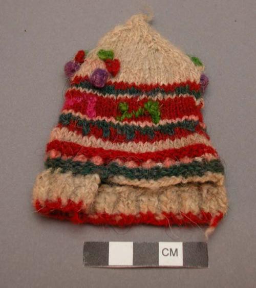 Miniature knitted baby's cap - used in fiesta of sta. barbara