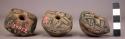 Terra cotta spindle whorls ornamented with incised lines