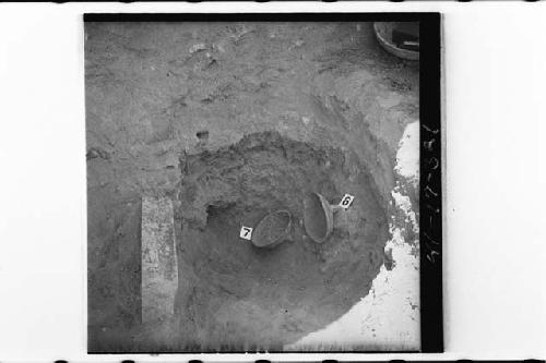 Vessels 6 and 7 and stone slab in situ at Cache 1 of Mound 7