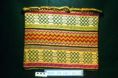 Weft-twined bag in yellows, greens, and red