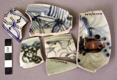 78 rim potsherds - glazed porcelain; ornate pattern in dark blue