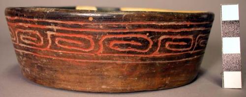 Restored tan to black pottery bowl - low-sided, red filled incising around rim