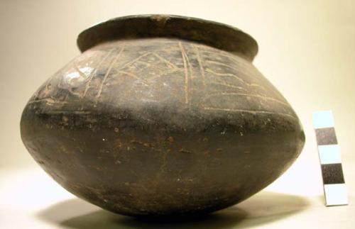 Ceramic jar, incised geometric exterior design, chipped rim, blackware