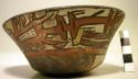Bowl painted in polychrome with mythical being, black and white quadrants bottom