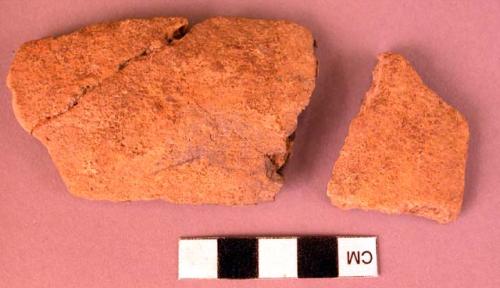 Fragments of plain pottery bowl