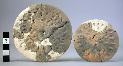 2 punctated pottery discs