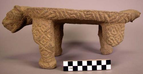 Stone metate, animal shape