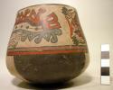 Bowl painted in polychrome with two killer whale beings, quadrants on bottom