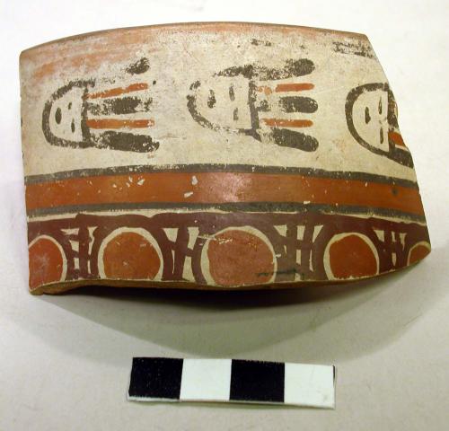 Rim sherd; painted with textile pattern and masks/faces