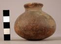 Small earthen jar covered by 22515