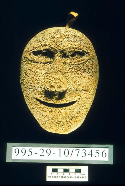 Carved human face of whalebone
