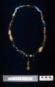 Necklace of fossilized ivory and blue stone beads