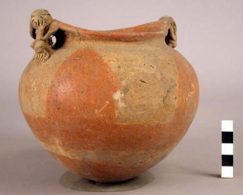 Pottery jar, with handle in shape of human figure