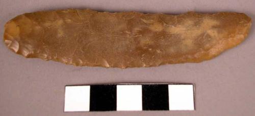 Flint blade (dun colored) chipped and flaked.  Eccentric type