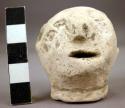 Crude pottery figurine head