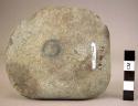 Ground stone fragment of palette, 1 side smooth, other broken, rounded corner
