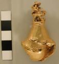 Gold bell with animal figures at top