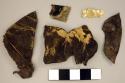 Fragments of gold ornaments - human figure