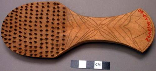 Hair brush, palm rib bristles, wooden, incised design