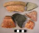 21 potsherds - shiny-surfaced red ware