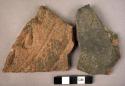 2 potsherds - coarse ware; 1 stamped with an antelope's hoof print as a design a