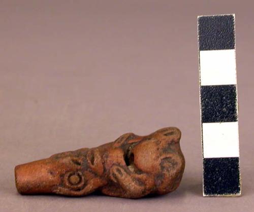 Pottery whistle in shape of human being