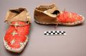 Pair of Sioux moccasins. Hard soles. Soft uppers sewn up heel.Trapezoidal tongue