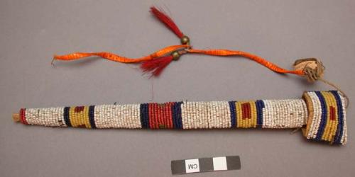 Case for awl or paint stick--rawhide tube with beadwork