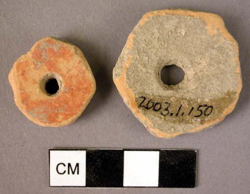 Cereamic body sherds, ground into disks, perforated, red slip, worn