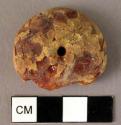 Fragmentary disk-shaped amber bead