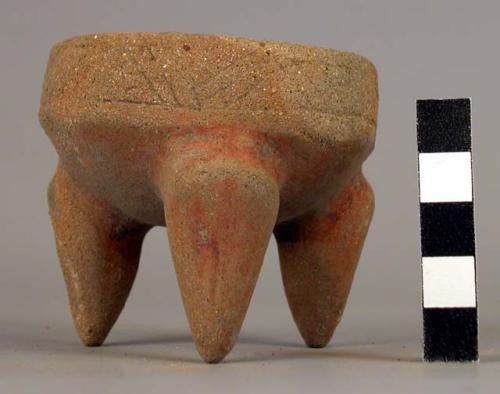 Small tripod pottery bowl with band of incised design - weathered and unknown wa